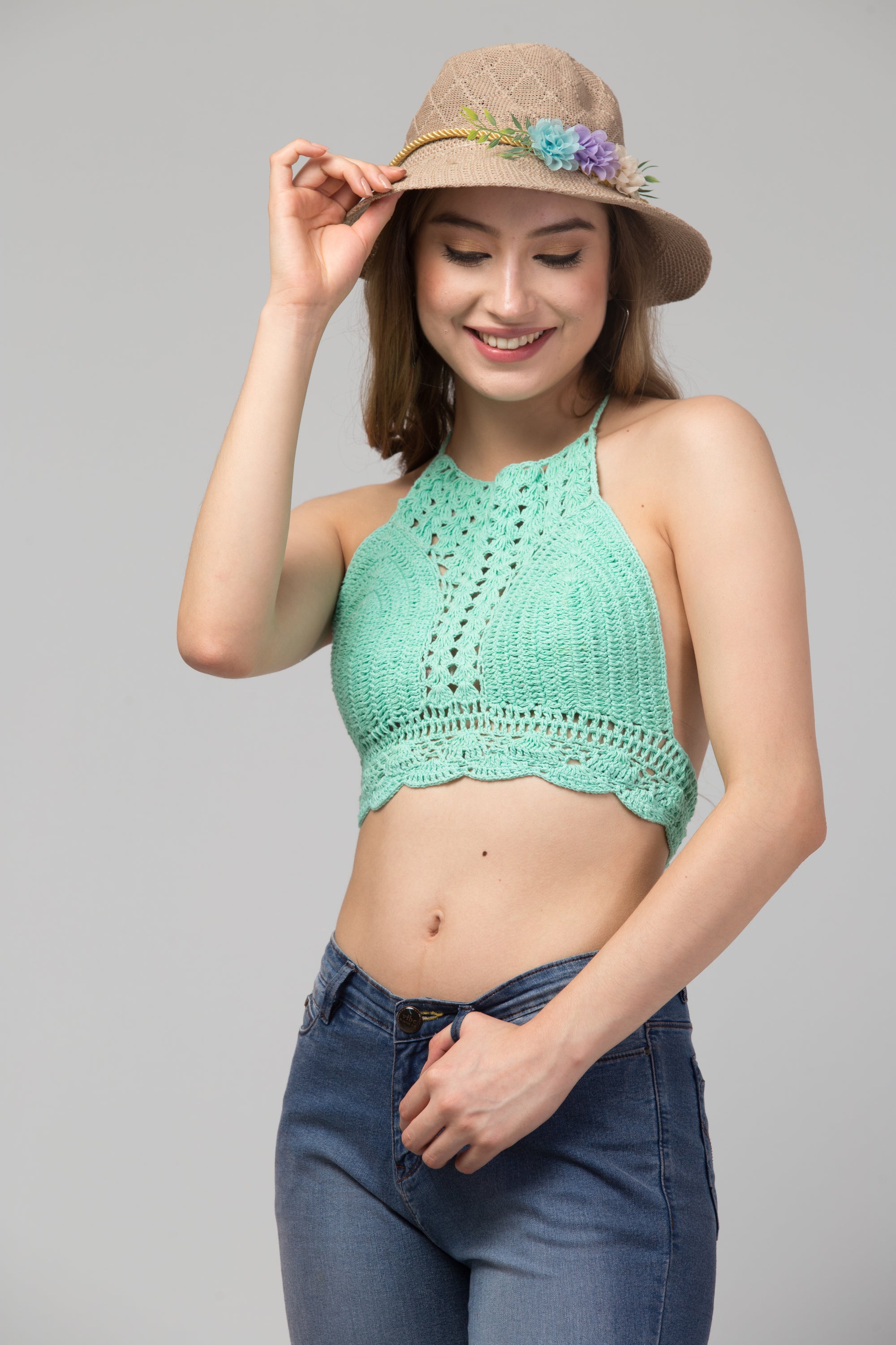 Caroline Crochet Crop Top-Bralette made from organic green fabric, showcasing intricate crochet design, perfect for summer fashion.