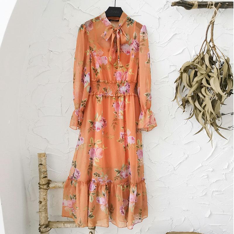 A stylish boho women chiffon dress featuring a bow neckline, trumpet sleeves, and floral patterns, perfect for summer occasions.