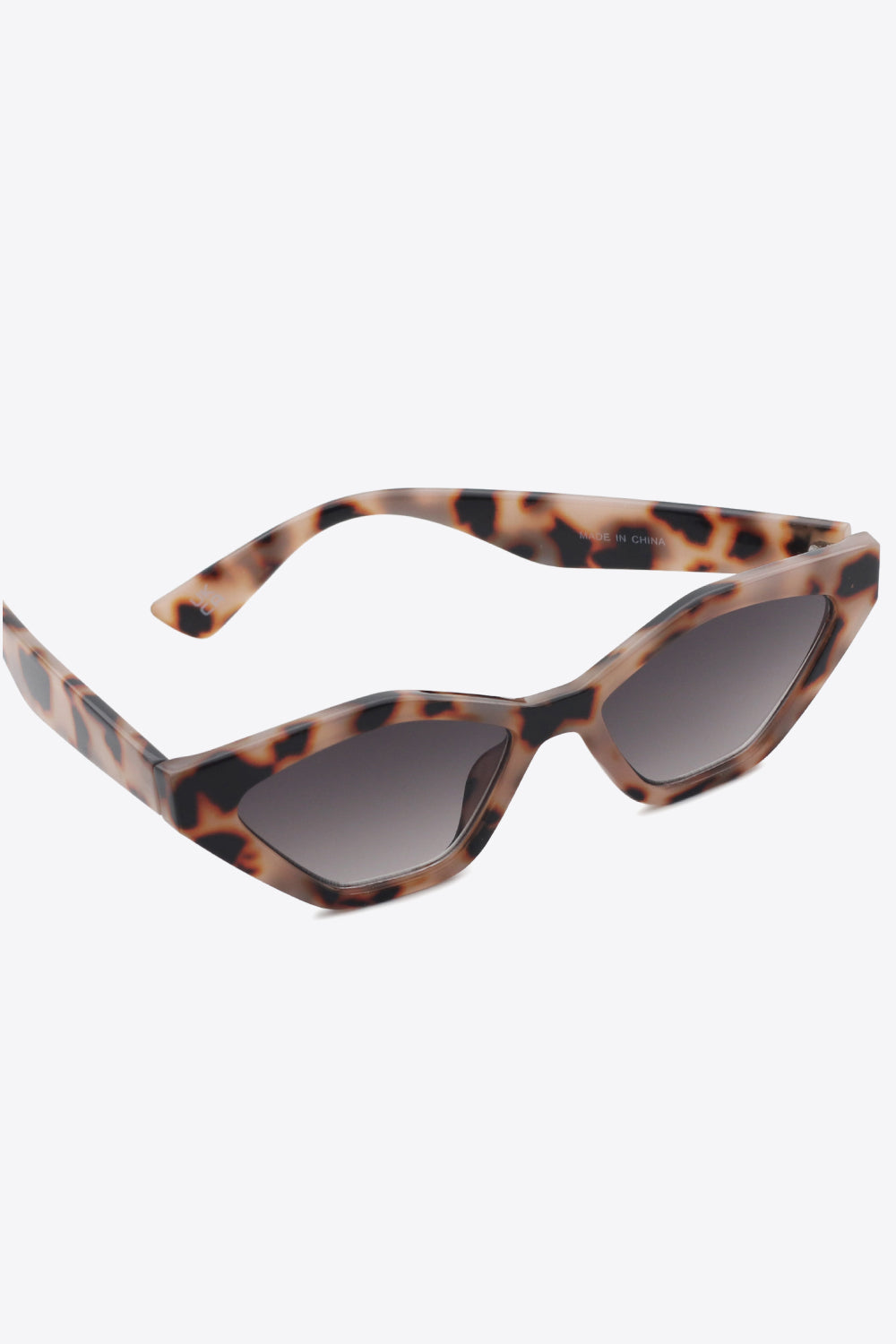 A pair of stylish cat eye polycarbonate sunglasses with UV400 protection, featuring a sleek design and included case.