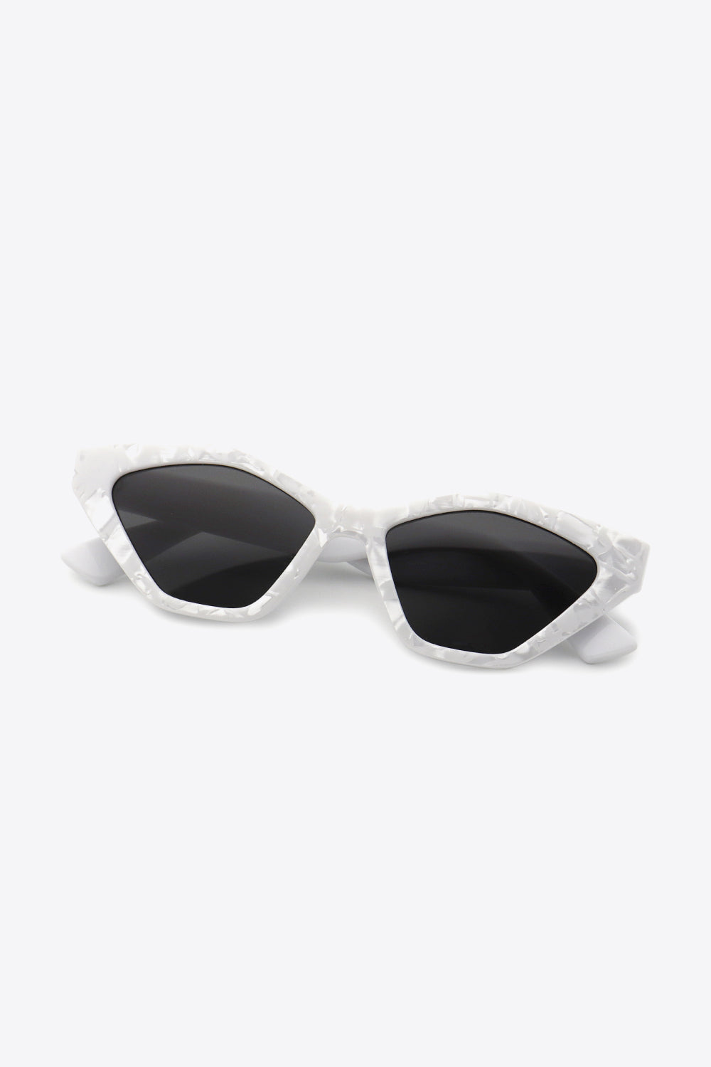 A pair of stylish cat eye polycarbonate sunglasses with UV400 protection, featuring a sleek design and included case.