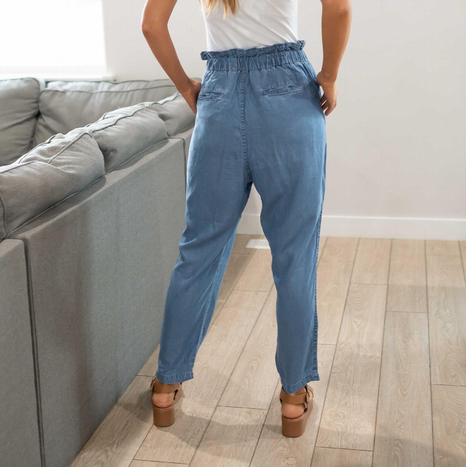 Stylish chambray drawstring paperbag waist pants with ruched waistband, perfect for casual and professional wear.