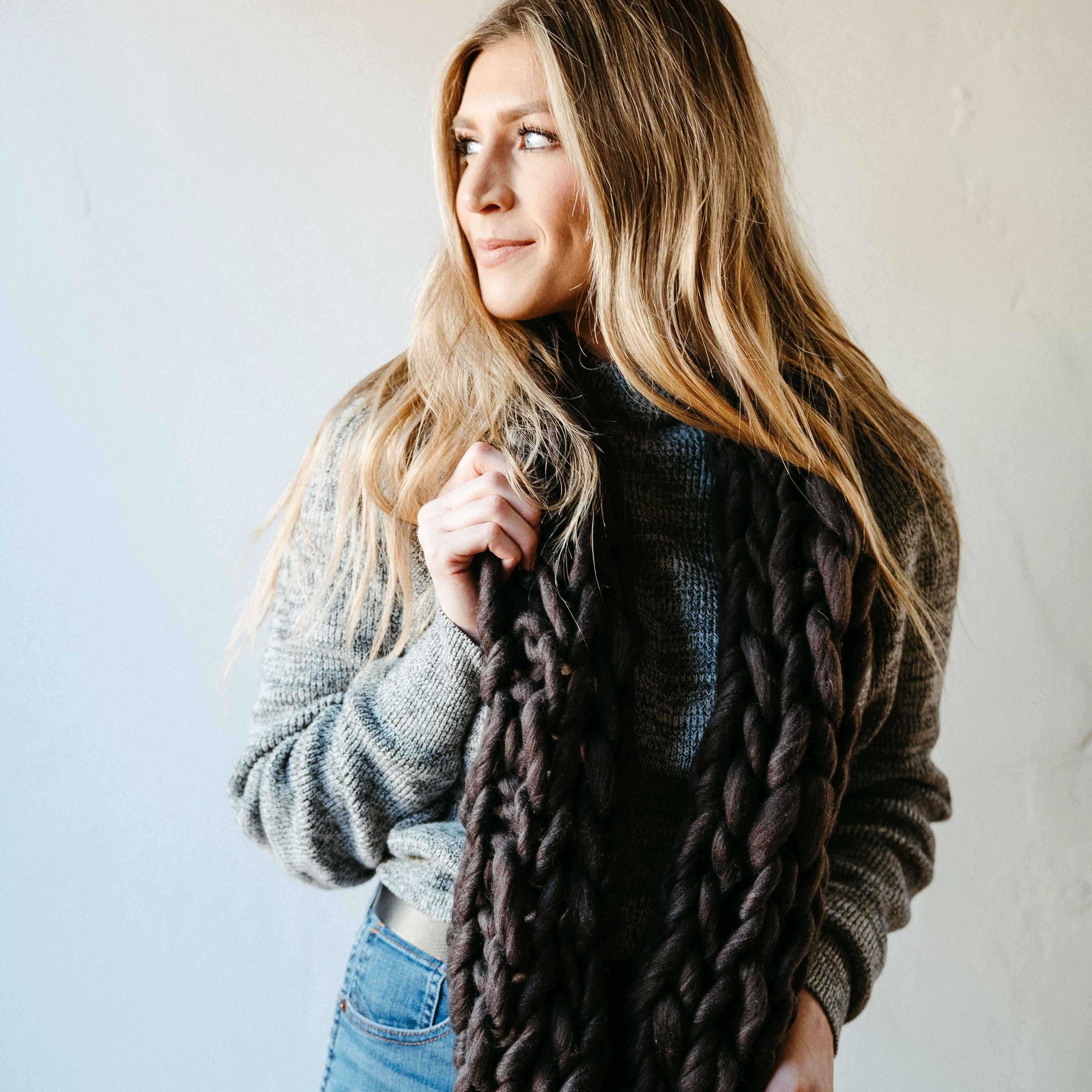 Charcoal Thick Knit Infinity Scarf displayed elegantly, showcasing its soft texture and cozy design, perfect for winter wear.