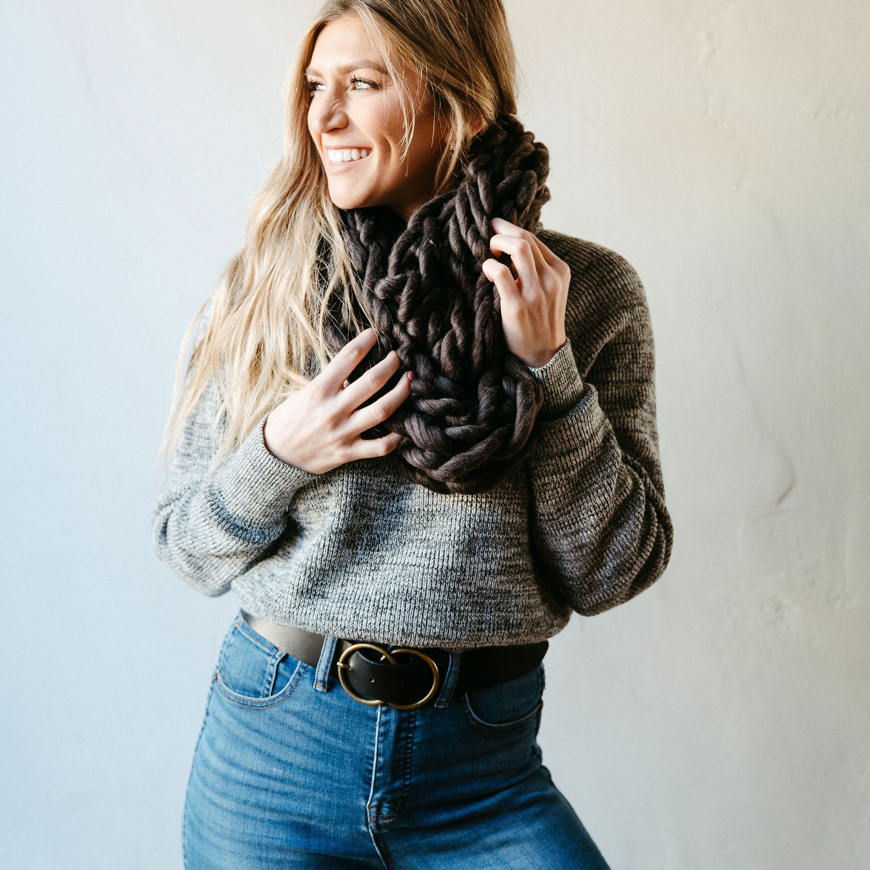 Charcoal Thick Knit Infinity Scarf displayed elegantly, showcasing its soft texture and cozy design, perfect for winter wear.