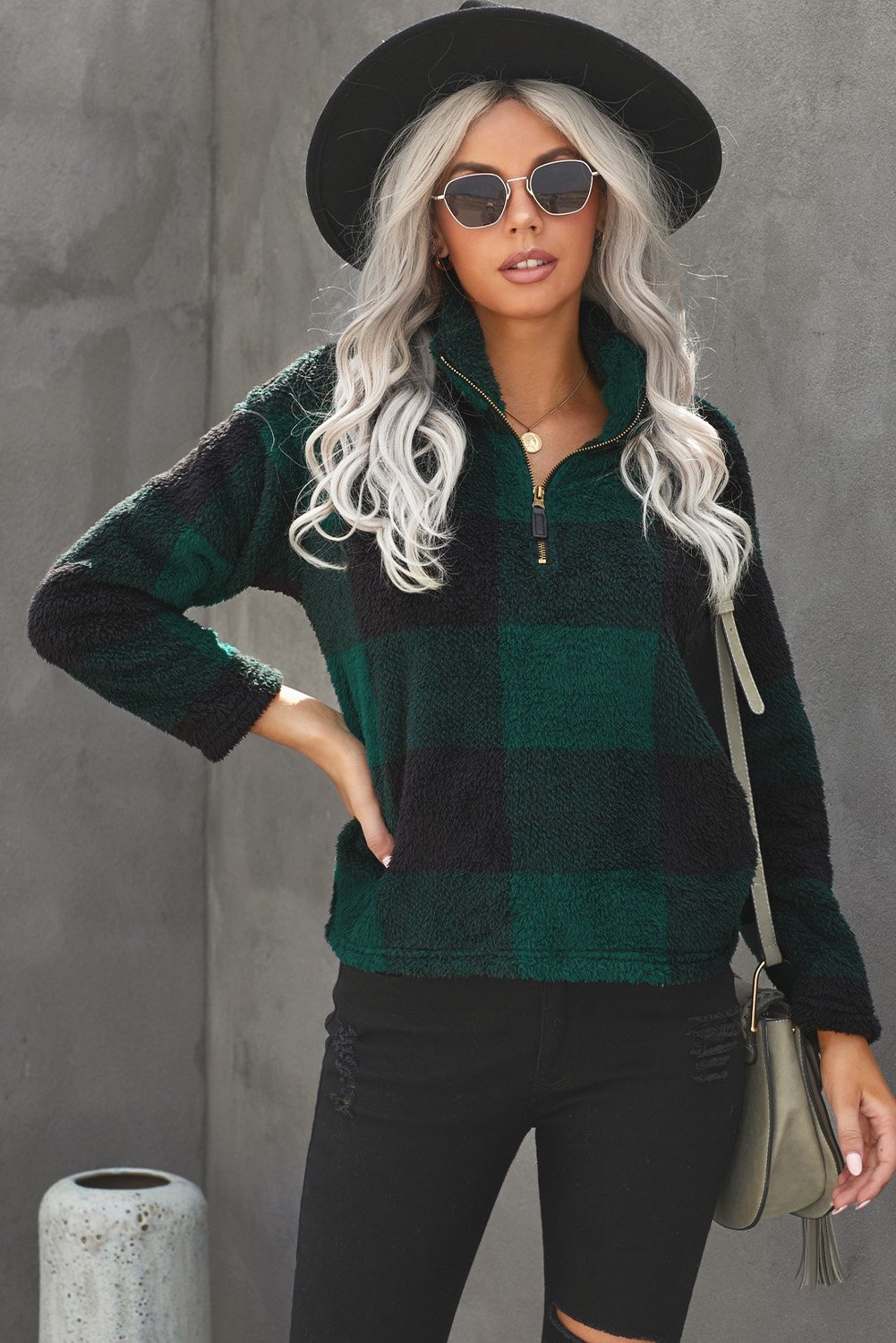 A stylish Checkered Half Zip Pullover featuring a trendy buffalo check print, standing collar, and cozy fabric, perfect for cold weather.