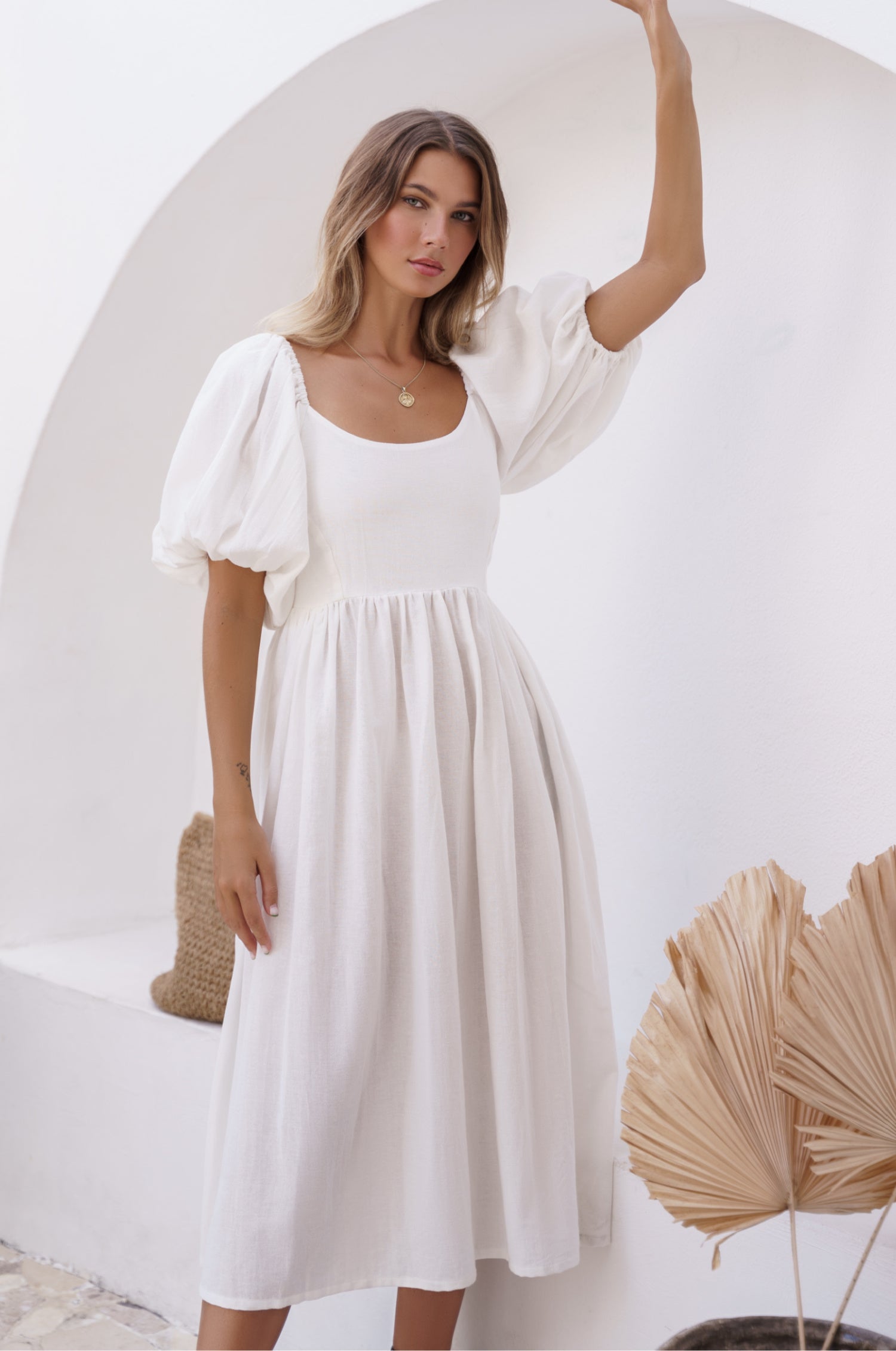 Cherie Puff Sleeve Midi Dress in pure linen with gathered puff sleeves and an oval neckline, perfect for summer outings.