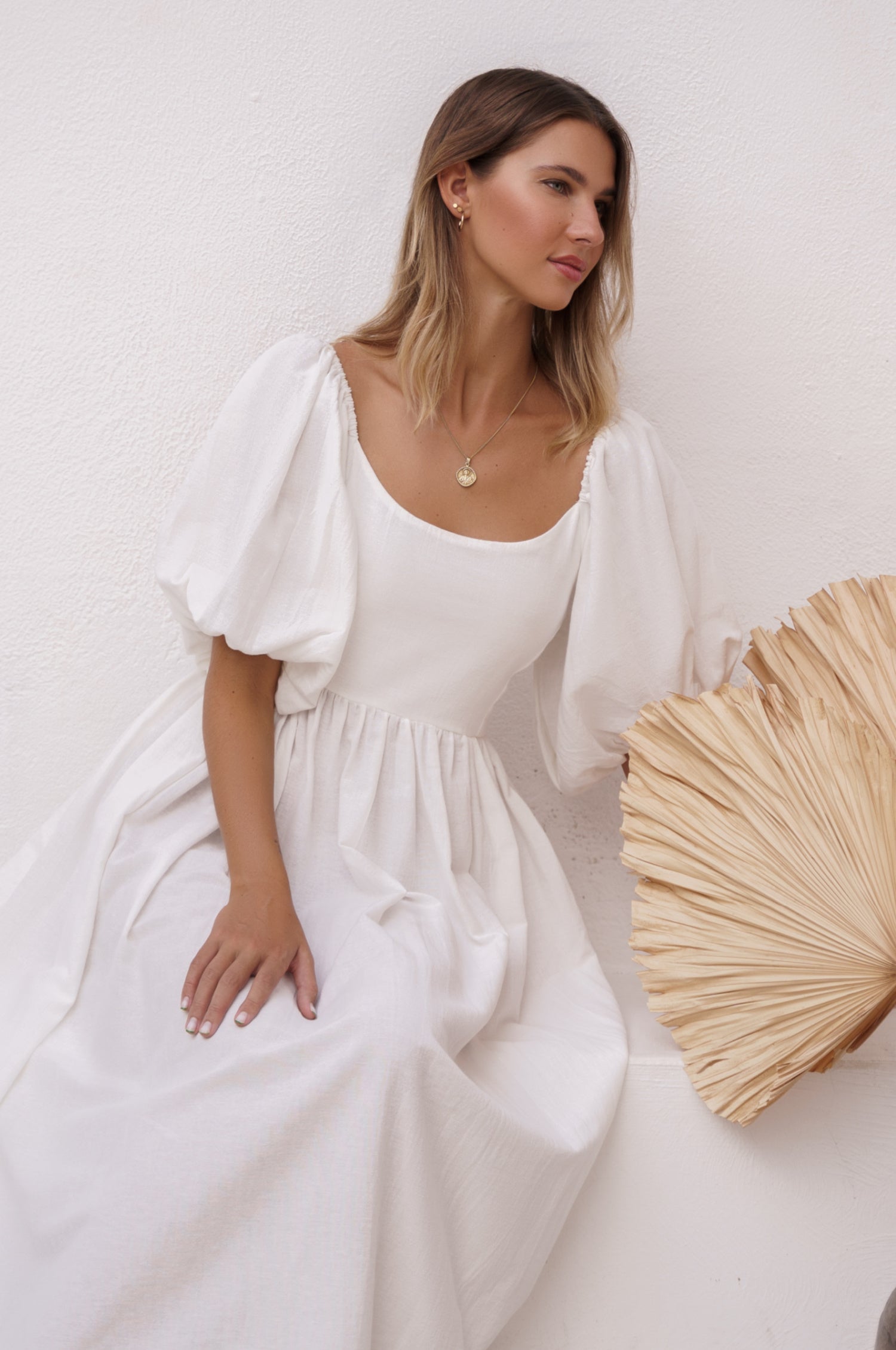 Cherie Puff Sleeve Midi Dress in pure linen with gathered puff sleeves and an oval neckline, perfect for summer outings.