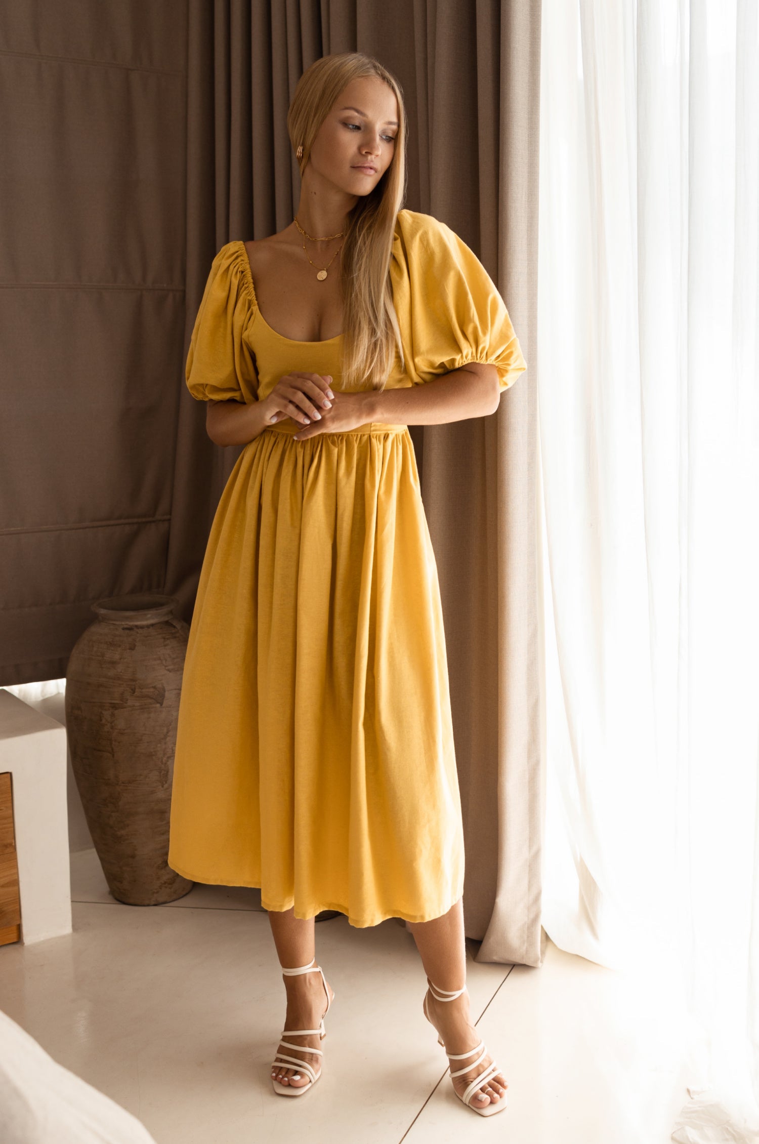 Cherie Puff Sleeve Midi Dress in pure linen with gathered puff sleeves and an oval neckline, perfect for summer outings.