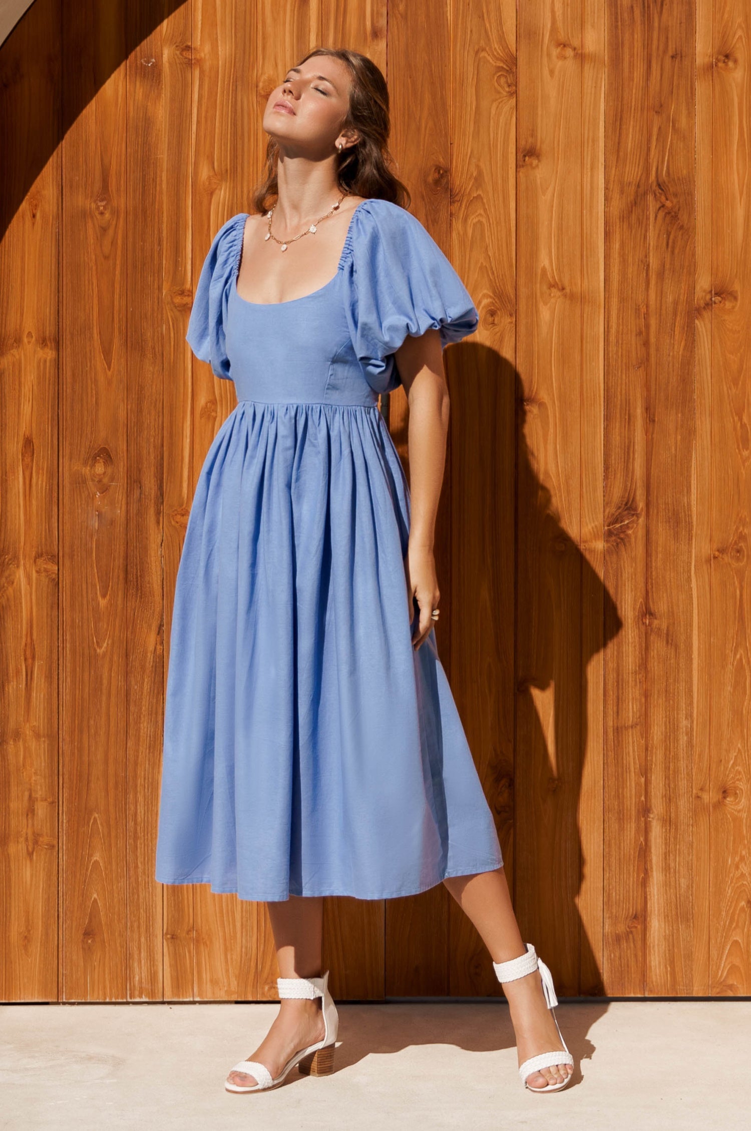 Cherie Puff Sleeve Midi Dress in pure linen with gathered puff sleeves and an oval neckline, perfect for summer outings.