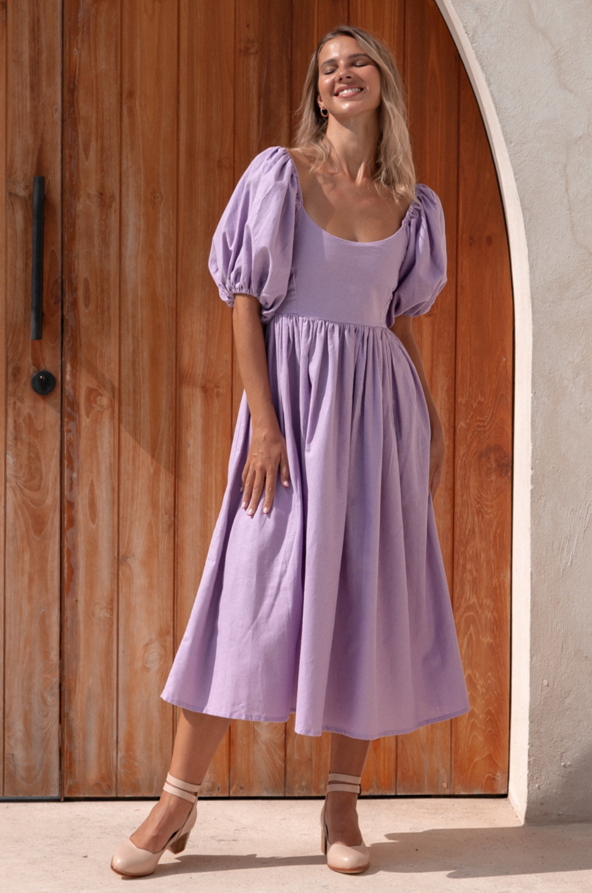 Cherie Puff Sleeve Midi Dress in pure linen with gathered puff sleeves and an oval neckline, perfect for summer outings.