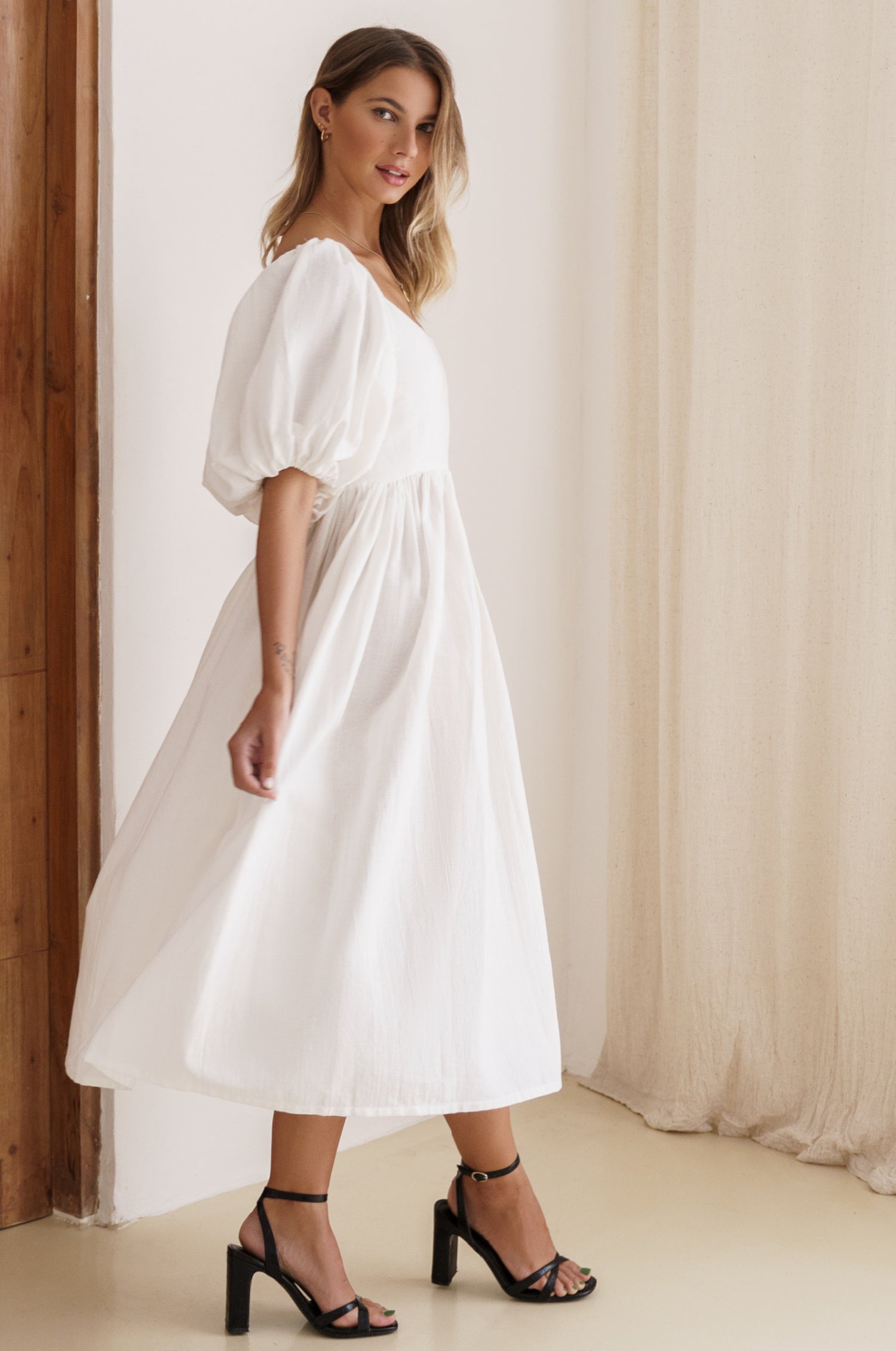 Cherie Puff Sleeve Midi Dress in pure linen with gathered puff sleeves and an oval neckline, perfect for summer outings.