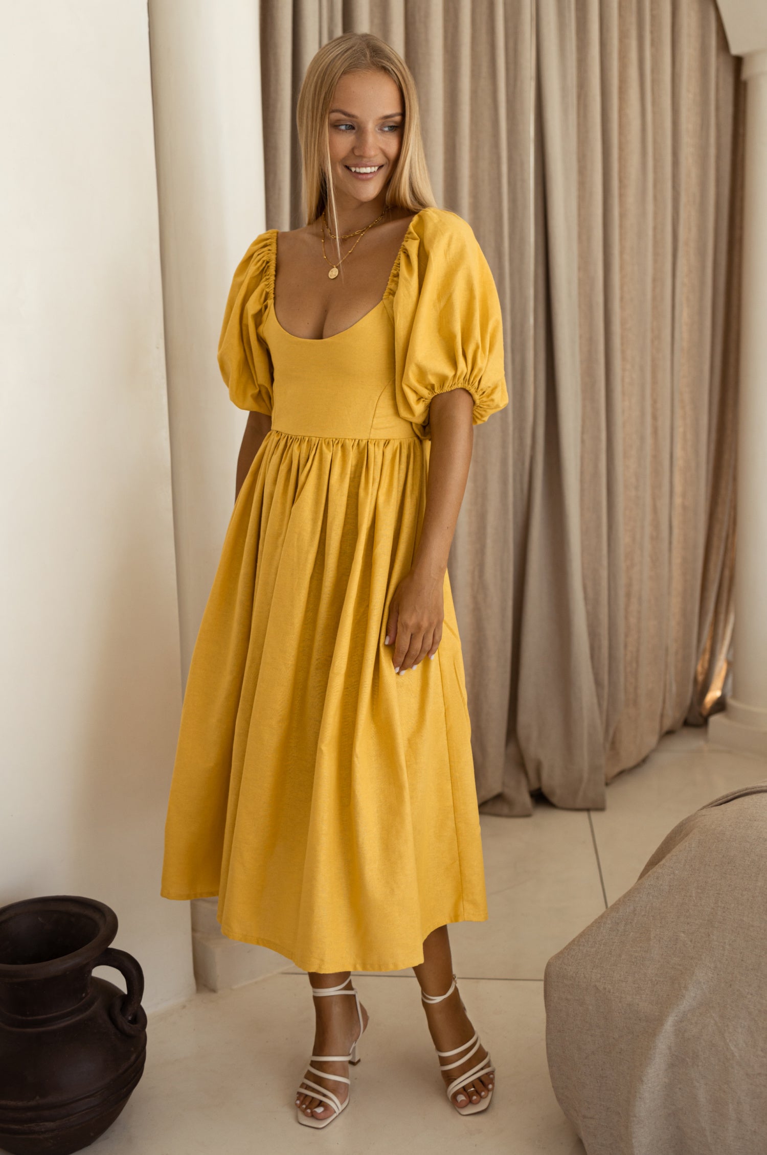 Cherie Puff Sleeve Midi Dress in pure linen with gathered puff sleeves and an oval neckline, perfect for summer outings.