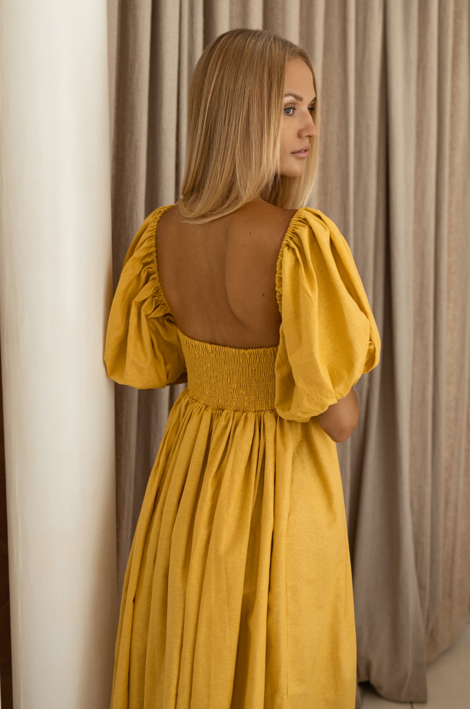 Cherie Puff Sleeve Midi Dress in pure linen with gathered puff sleeves and an oval neckline, perfect for summer outings.