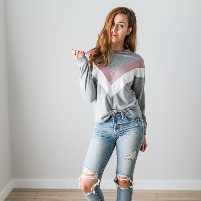 A vibrant Chevron Long Sleeve Top featuring a color blocked, chunky chevron design, perfect for casual wear.