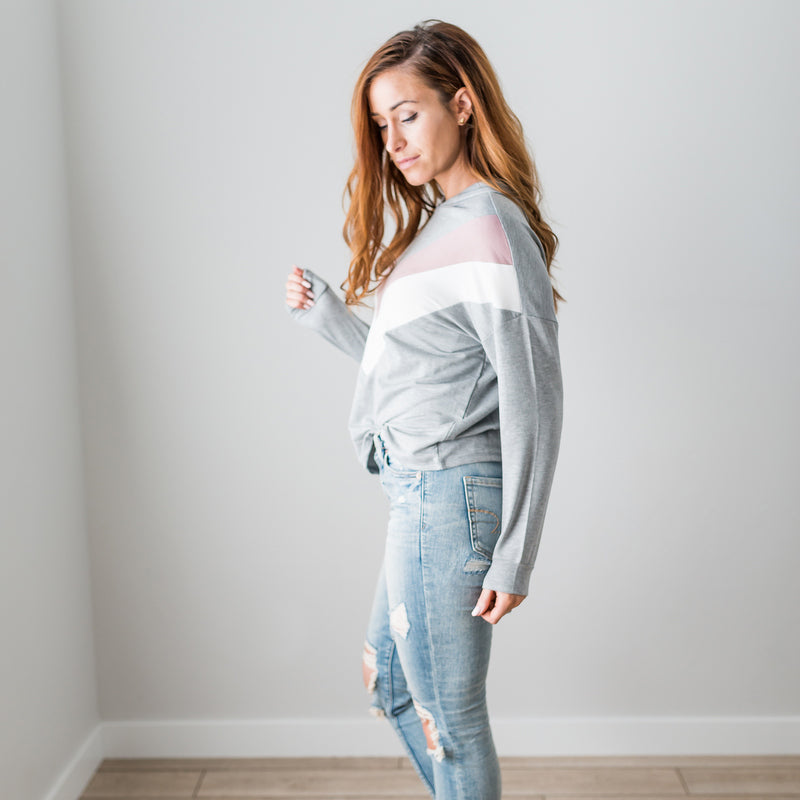 A vibrant Chevron Long Sleeve Top featuring a color blocked, chunky chevron design, perfect for casual wear.