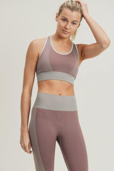 Chevron Track Seamless Hybrid Racerback Sports Bra featuring chevron lines and adjustable straps, designed for comfort and style.