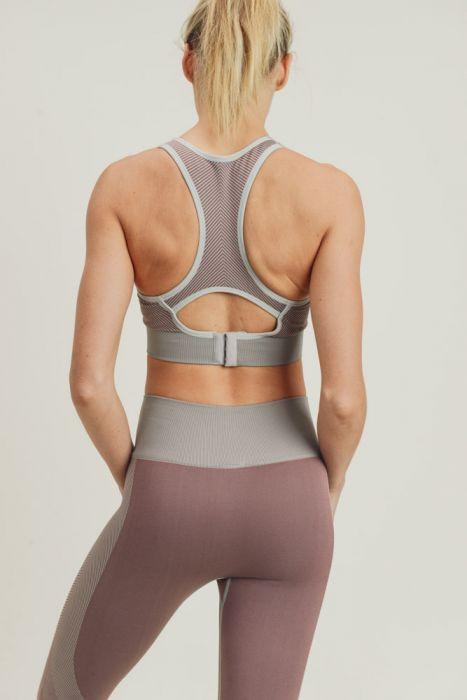 Chevron Track Seamless Hybrid Racerback Sports Bra featuring chevron lines and adjustable straps, designed for comfort and style.