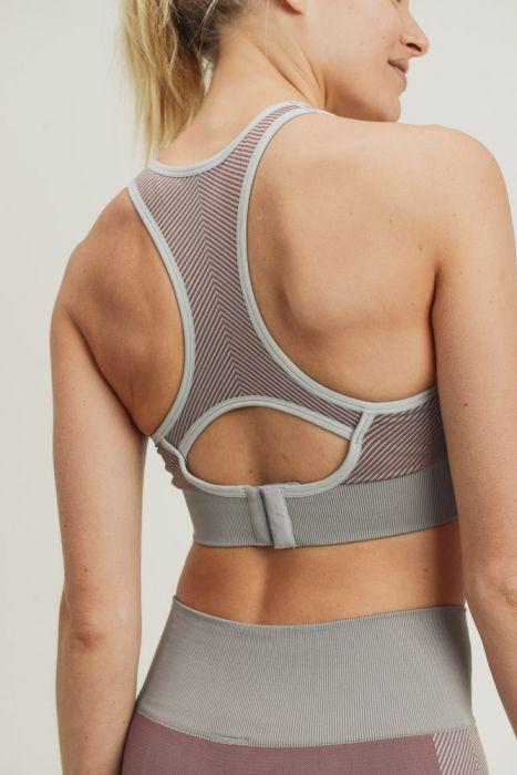 Chevron Track Seamless Hybrid Racerback Sports Bra featuring chevron lines and adjustable straps, designed for comfort and style.