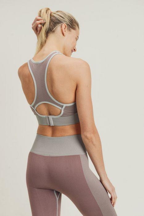 Chevron Track Seamless Hybrid Racerback Sports Bra featuring chevron lines and adjustable straps, designed for comfort and style.