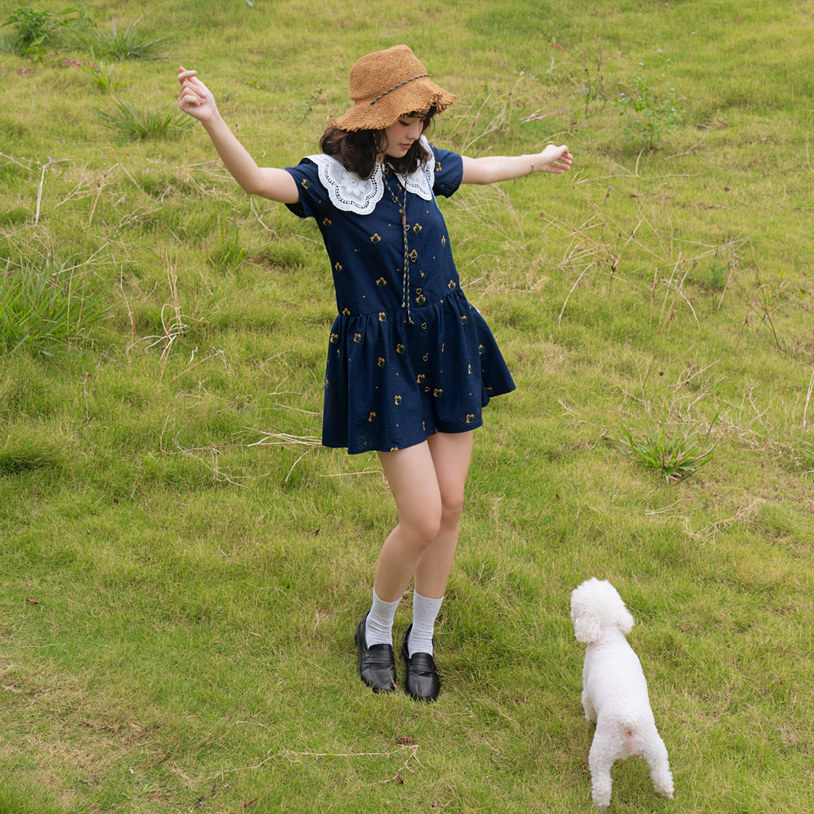 Cheezy Jumpsuit featuring floral embroidery and a lace neck design, showcasing a stylish skirt-pants silhouette.