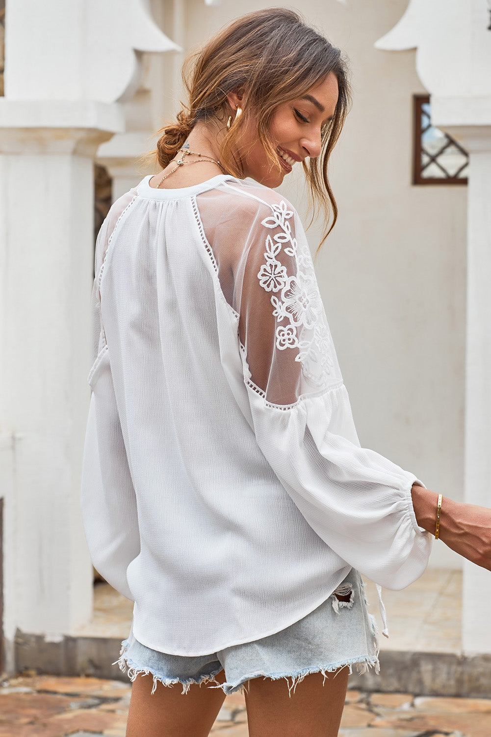 Chic white formal blouse featuring lace details, v-neckline, and long balloon sleeves, perfect for spring and autumn occasions.