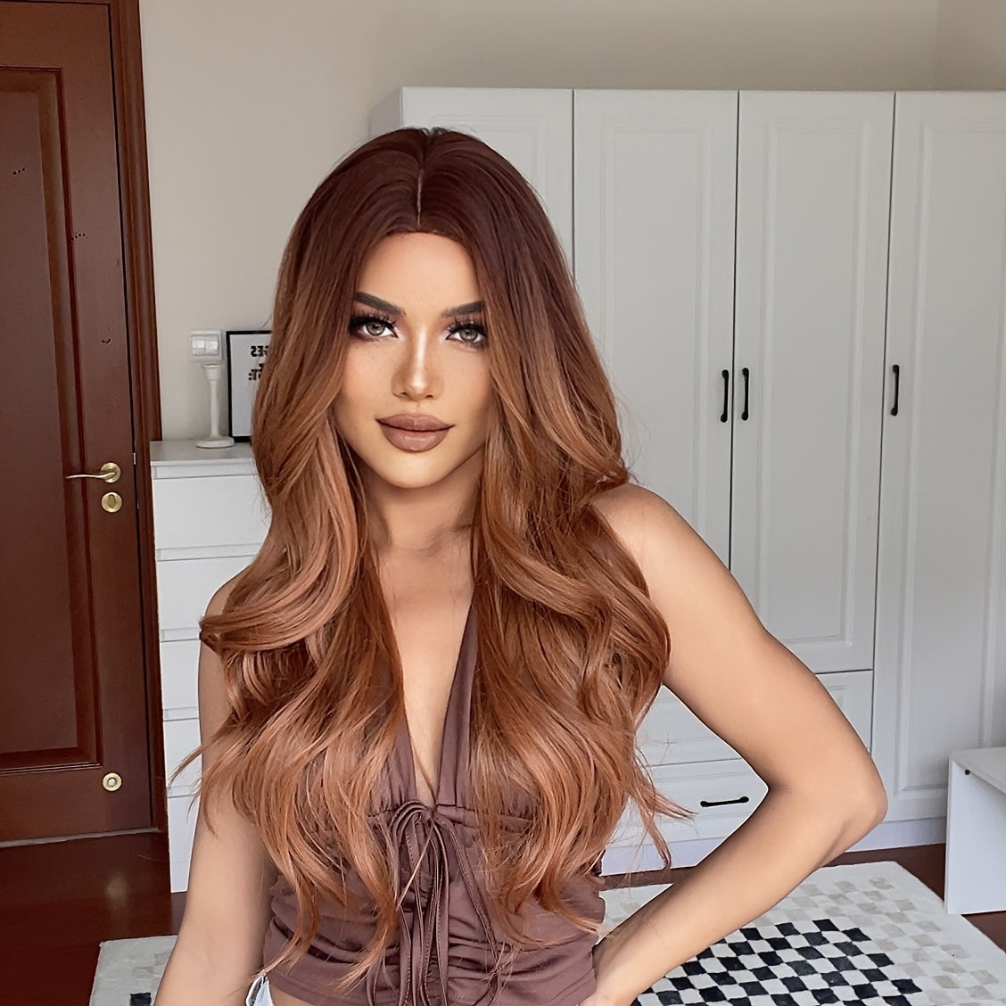 Cinnamon Wig featuring wavy brown synthetic hair with a monofilament cap, ideal for women seeking a stylish and comfortable hair solution.