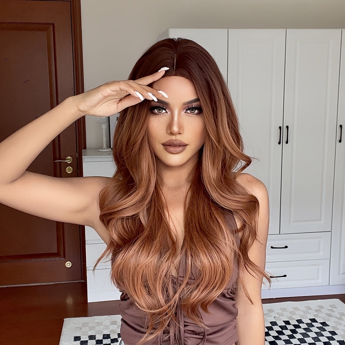 Cinnamon Wig featuring wavy brown synthetic hair with a monofilament cap, ideal for women seeking a stylish and comfortable hair solution.