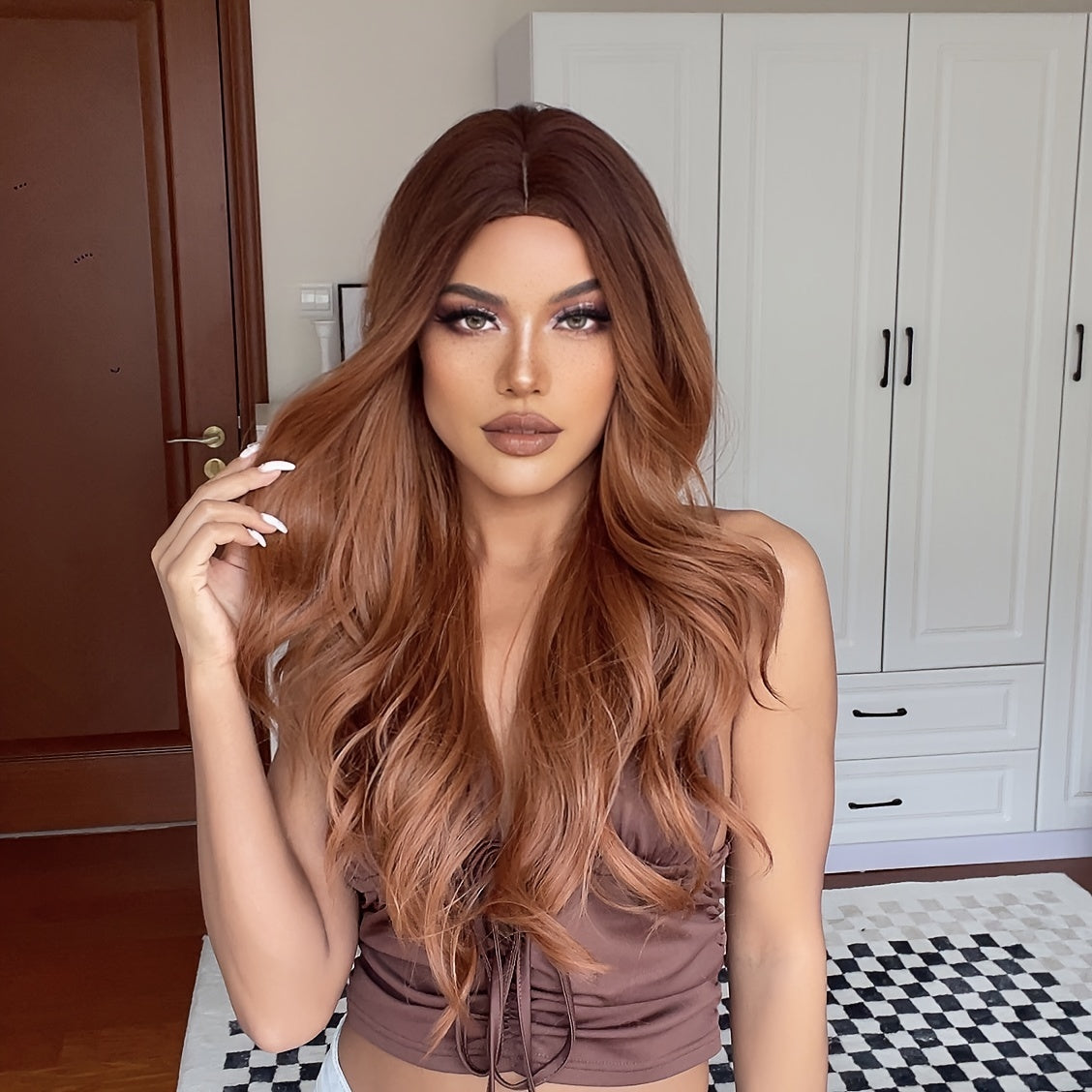 Cinnamon Wig featuring wavy brown synthetic hair with a monofilament cap, ideal for women seeking a stylish and comfortable hair solution.