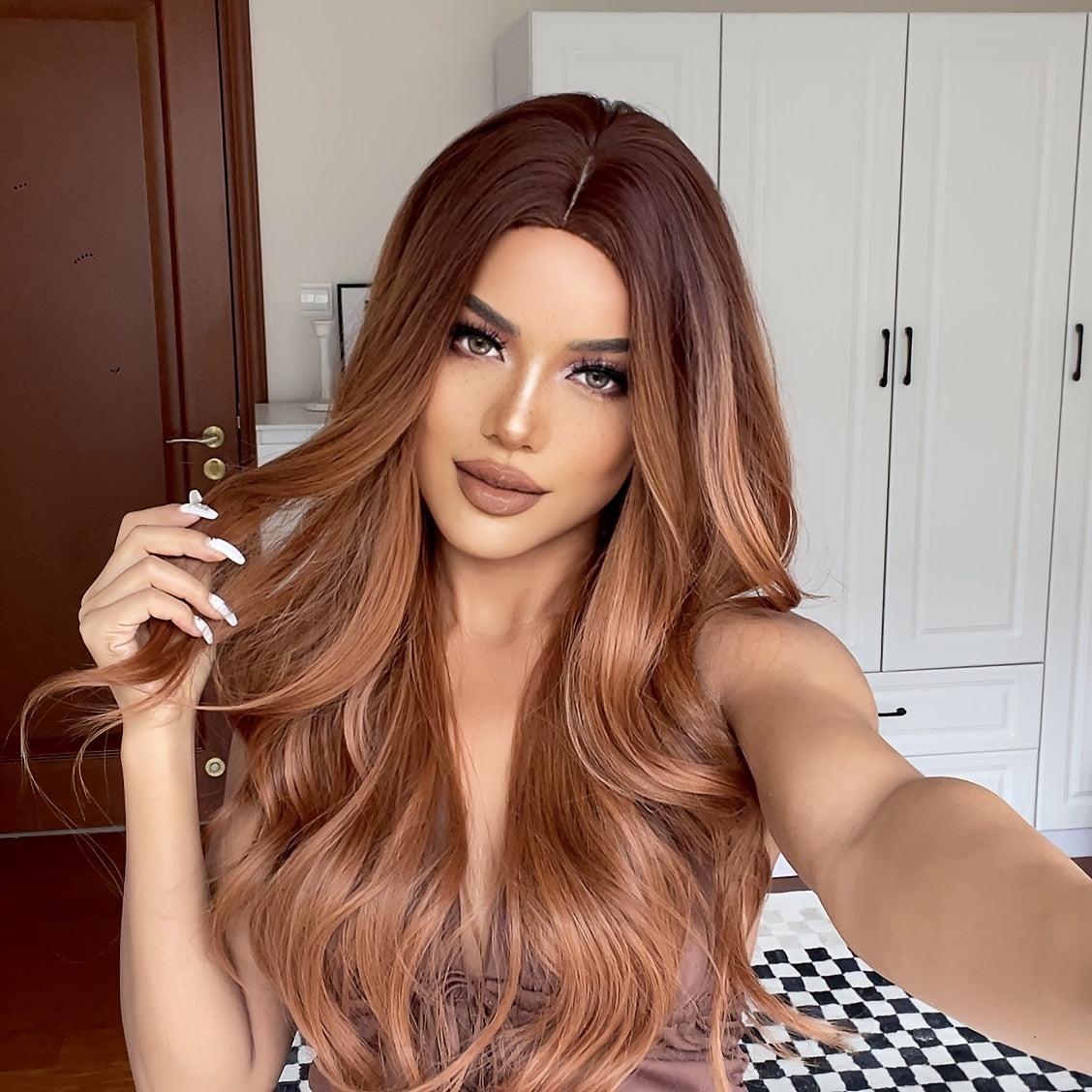 Cinnamon Wig featuring wavy brown synthetic hair with a monofilament cap, ideal for women seeking a stylish and comfortable hair solution.