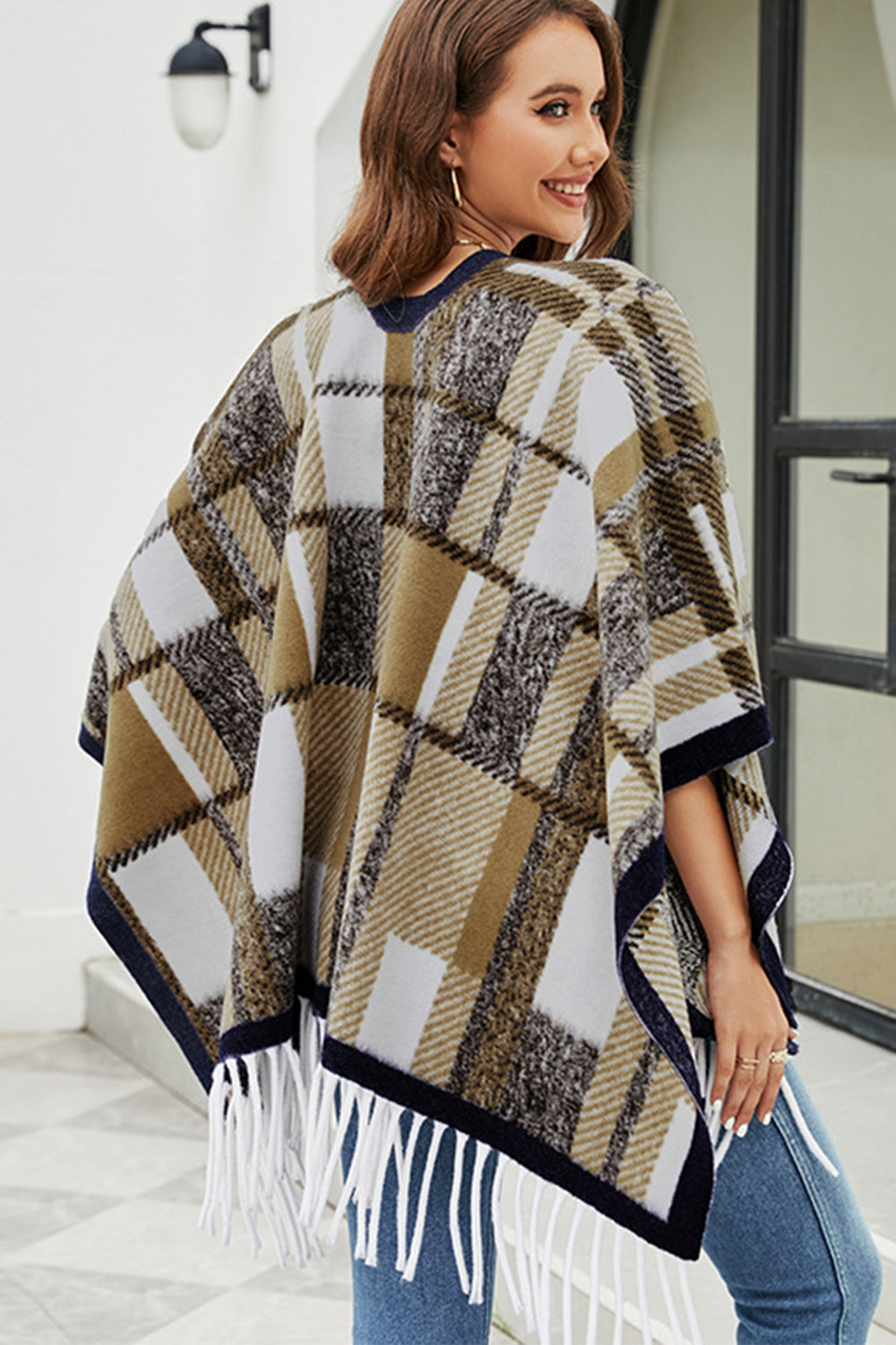 Cloak Sleeve Fringe Detail Poncho featuring a stylish plaid pattern and long sleeves, perfect for casual and classy occasions.