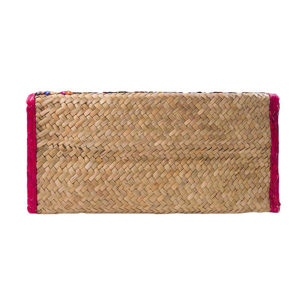 Handcrafted clutch bag featuring colorful embroidery triangles and red trim, made from natural palm leaves.