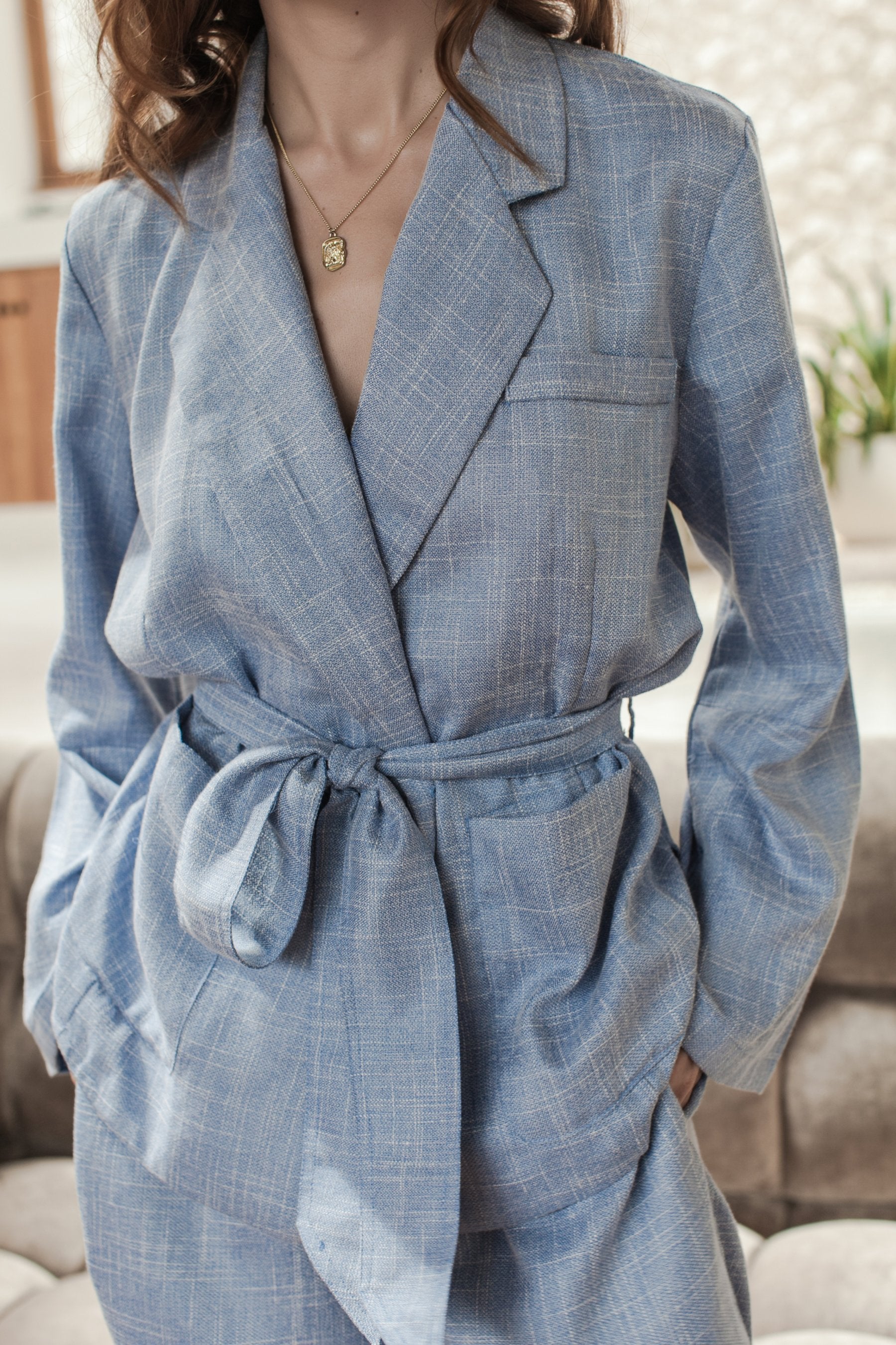 Coco Cotton Belted Blazer in Latte color, featuring structured shoulders and a matching tie belt, styled elegantly.