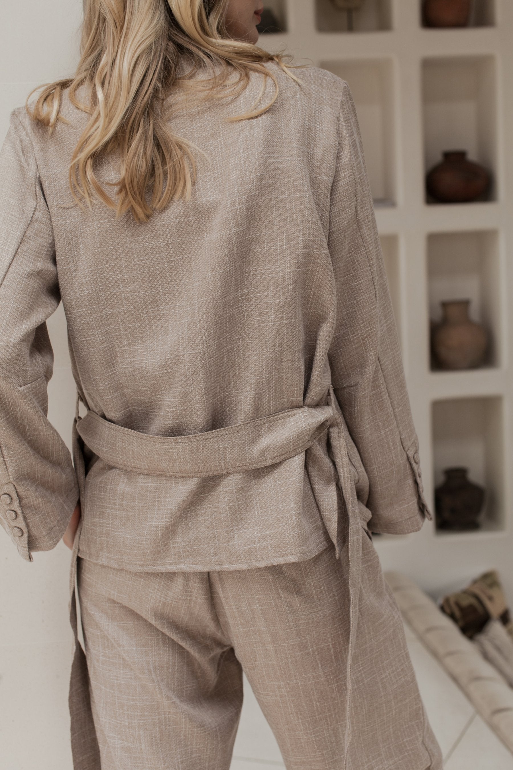 Coco Cotton Belted Blazer in Latte color, featuring structured shoulders and a matching tie belt, styled elegantly.