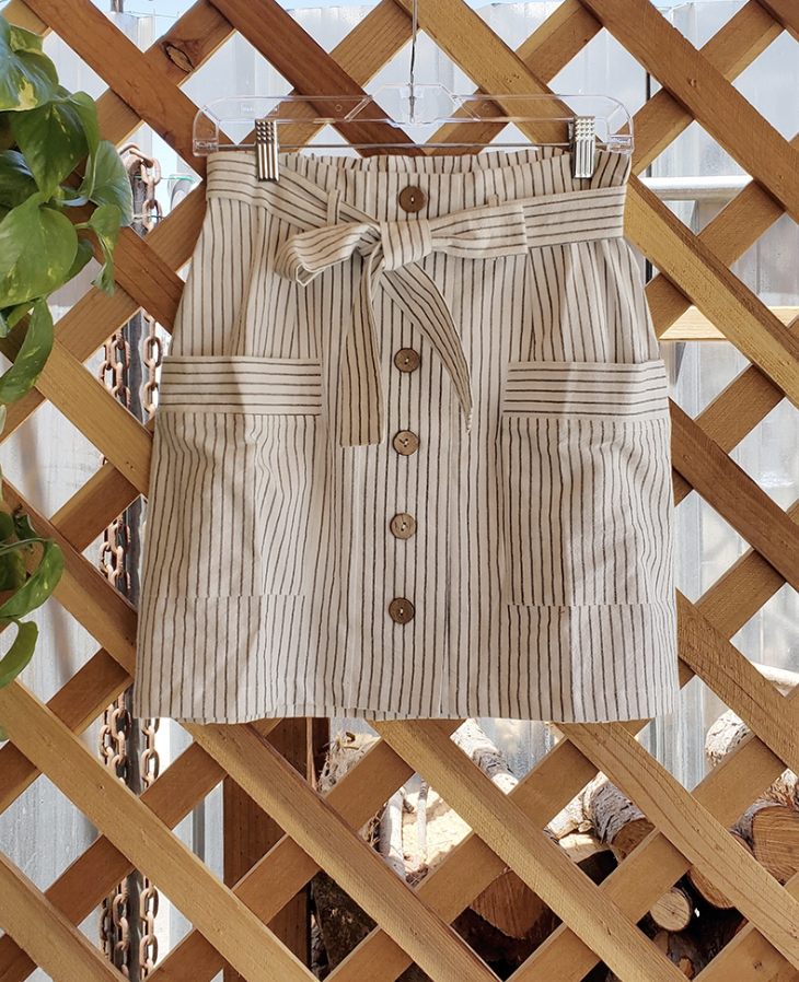 Coconut Button Stripe Woven Skirt in Cream with charcoal stripes and matching belt, featuring functional accent pockets.