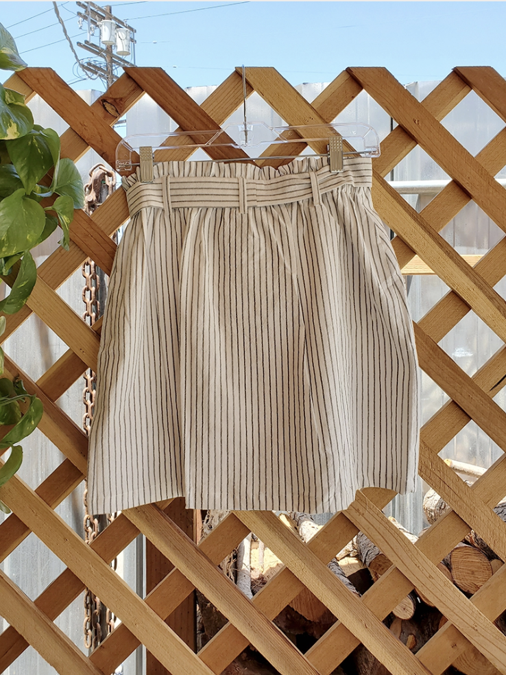 Coconut Button Stripe Woven Skirt in Cream with charcoal stripes and matching belt, featuring functional accent pockets.