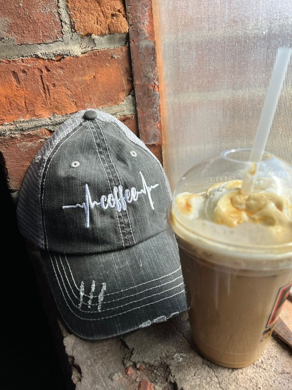 Coffee Heartbeat Trucker Hat featuring a stylish embroidered design, made of herringbone fabric with a Velcro closure.