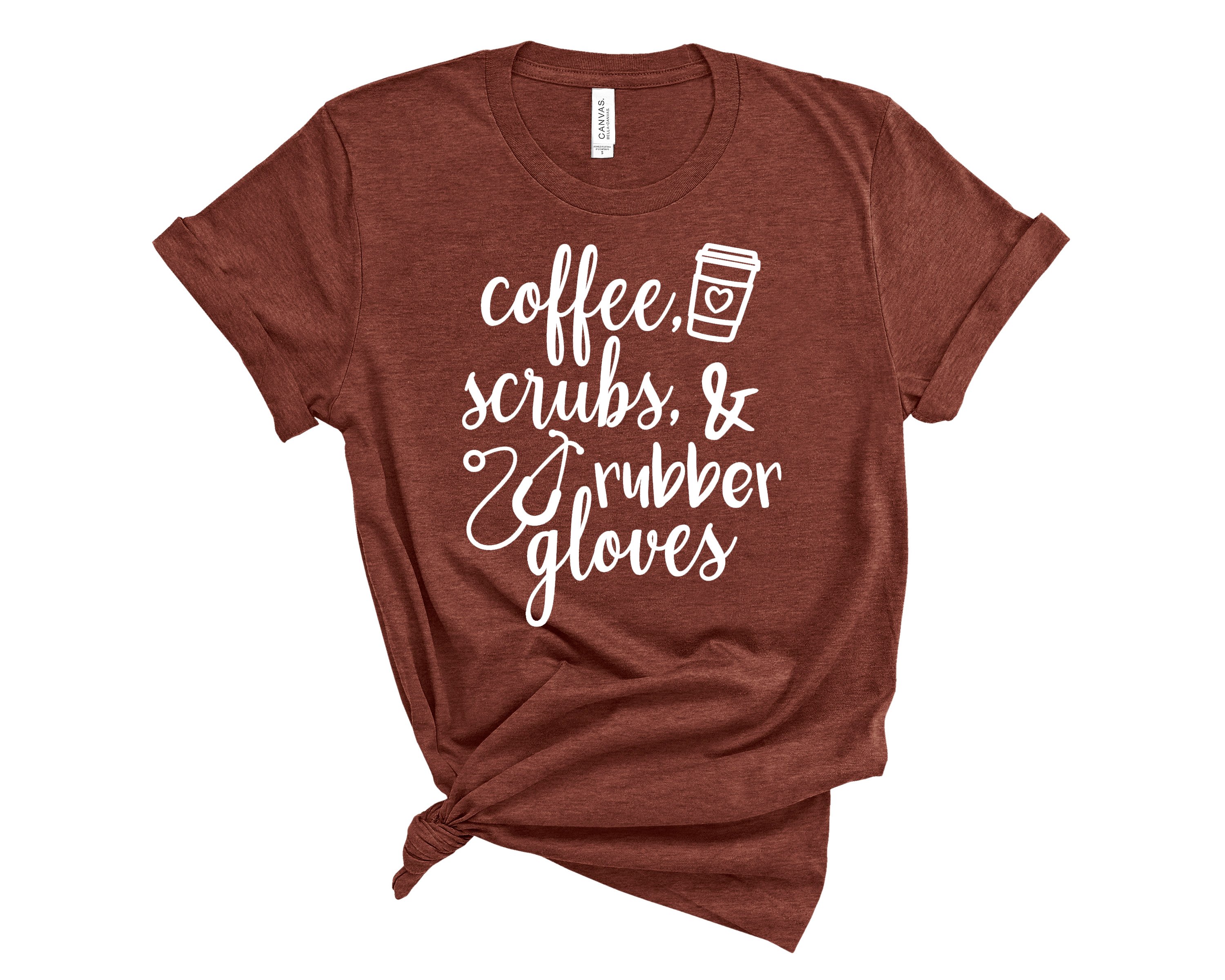 A soft, unisex Coffee Scrubs and Rubber Gloves Nurses Tee, featuring a fun design perfect for healthcare professionals.