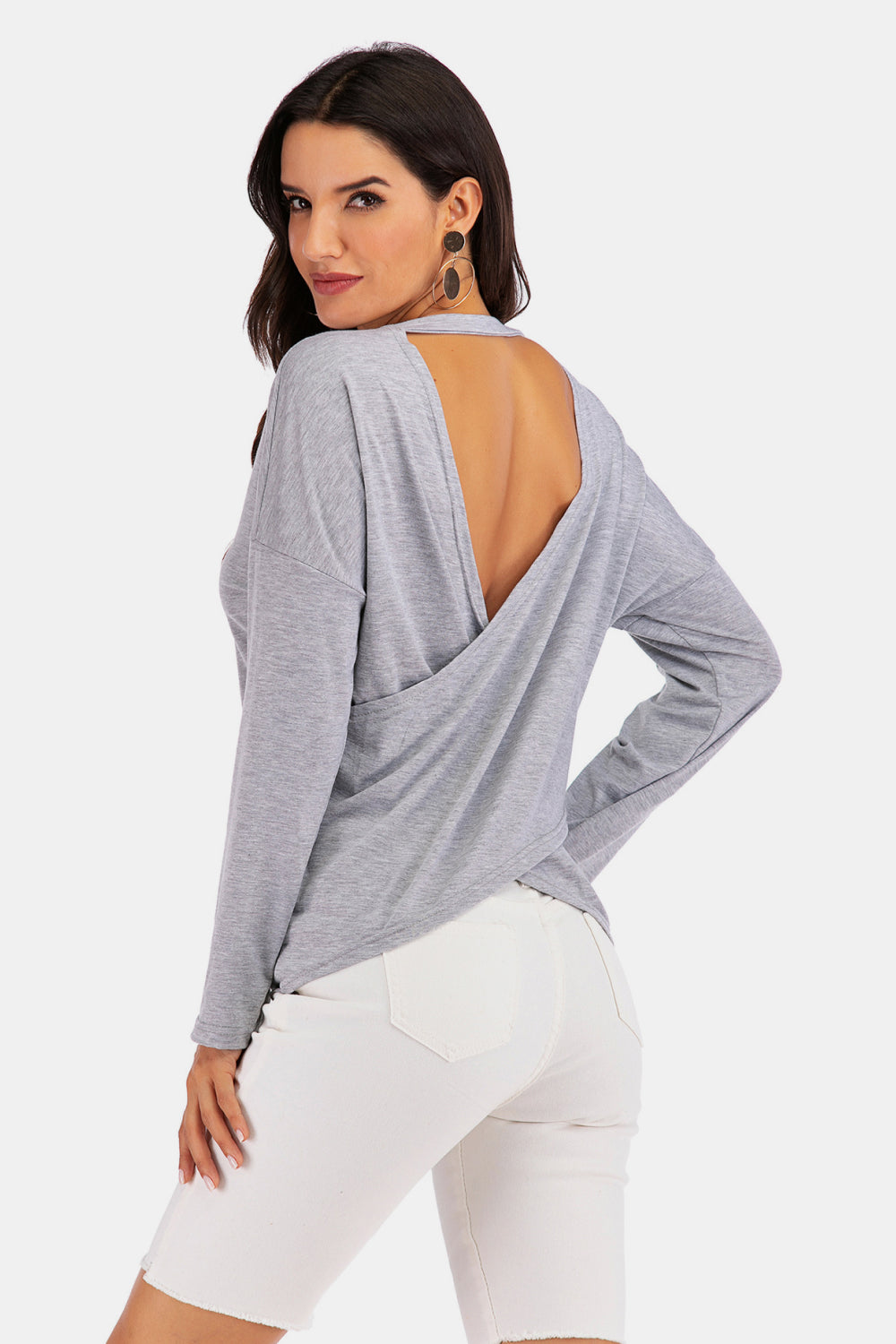 Cold-Shoulder Asymmetrical Neck Sweatshirt featuring crisscross open back and long sleeves in a studio setting.