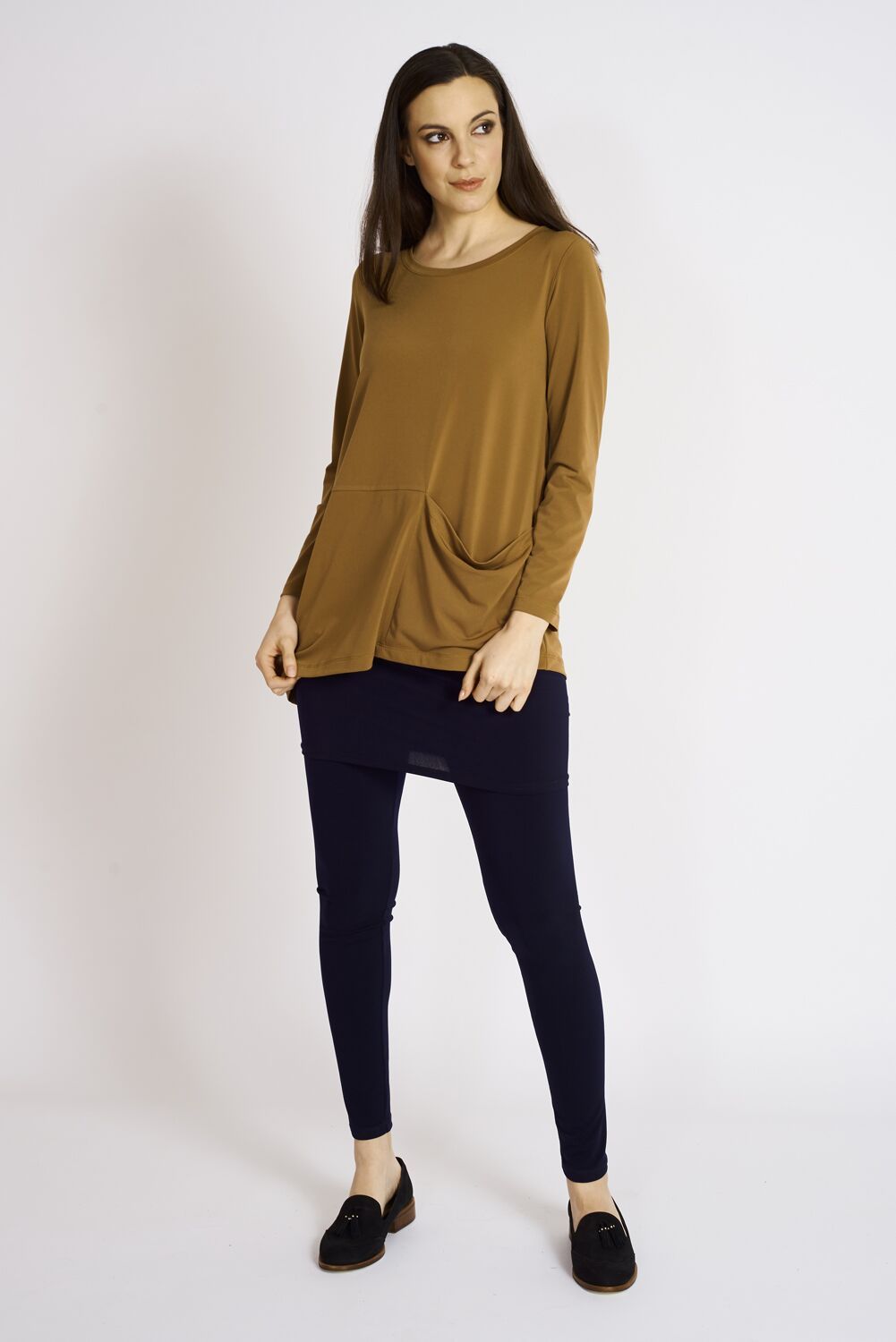 Collins Pocket Tunic in various colors, showcasing its stylish design and functional pockets.