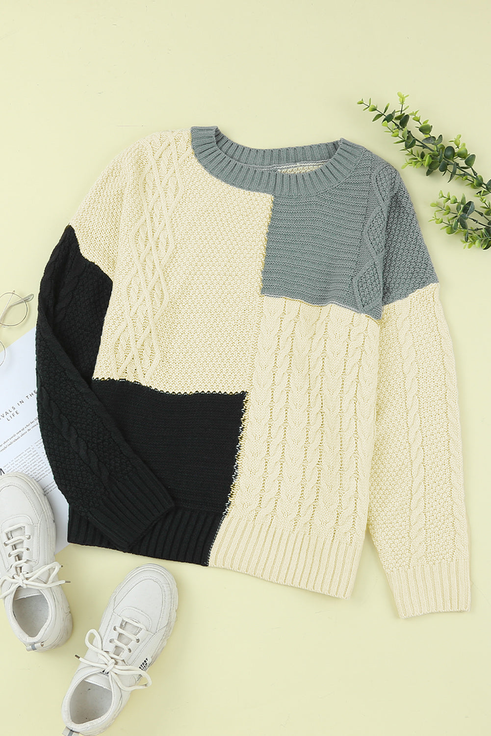 Color Block Mixed Knit Sweater displayed in a flat lay outdoors, showcasing its chic design and vibrant colors.