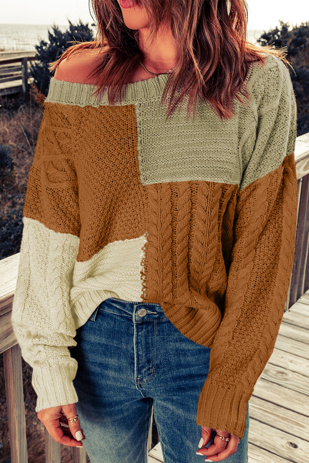 Color Block Mixed Knit Sweater displayed in a flat lay outdoors, showcasing its chic design and vibrant colors.