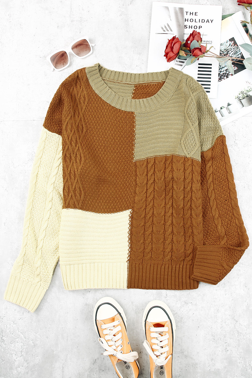 Color Block Mixed Knit Sweater displayed in a flat lay outdoors, showcasing its chic design and vibrant colors.