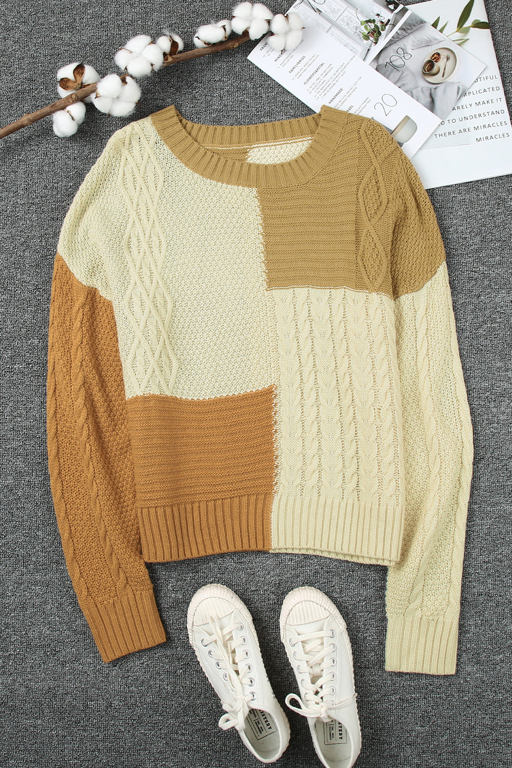 Color Block Mixed Knit Sweater displayed in a flat lay outdoors, showcasing its chic design and vibrant colors.