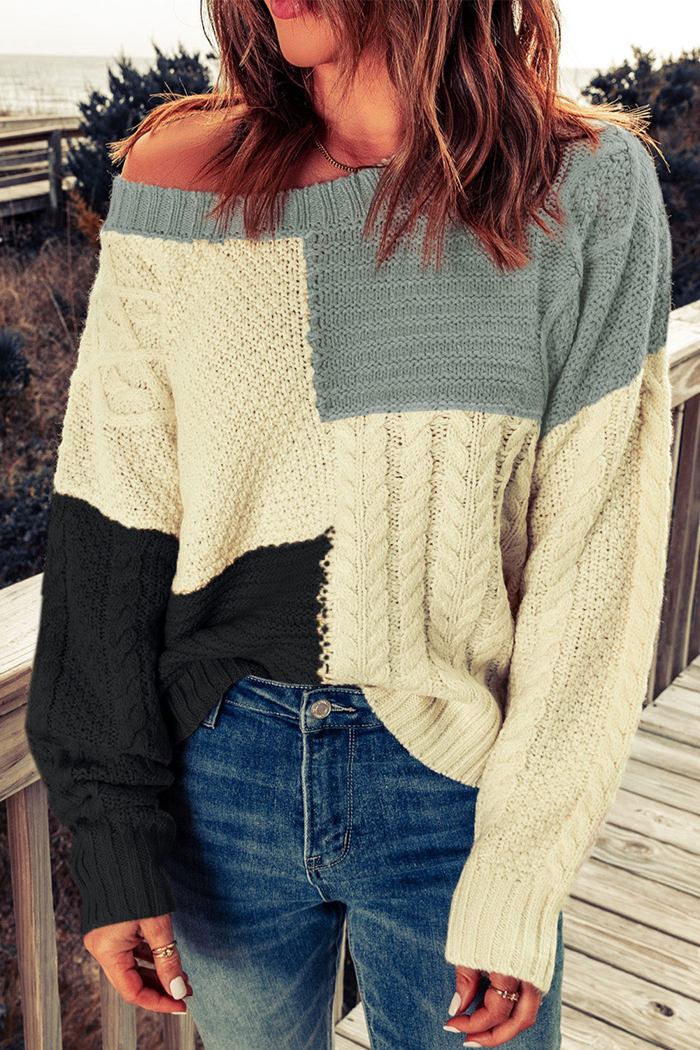 Color Block Mixed Knit Sweater displayed in a flat lay outdoors, showcasing its chic design and vibrant colors.