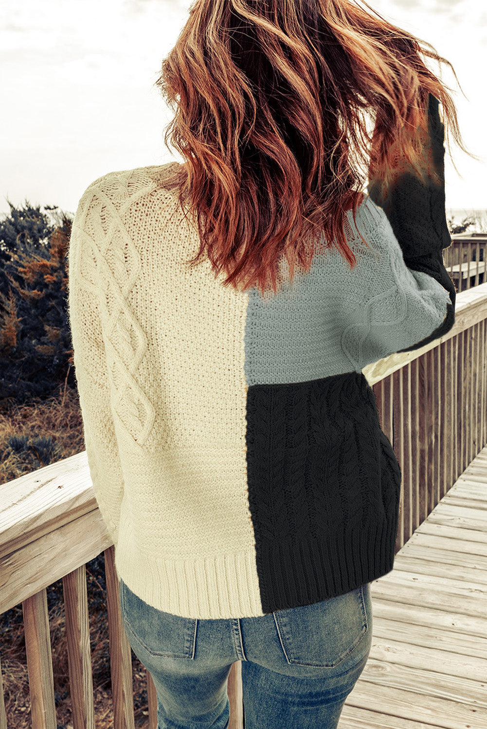 Color Block Mixed Knit Sweater displayed in a flat lay outdoors, showcasing its chic design and vibrant colors.