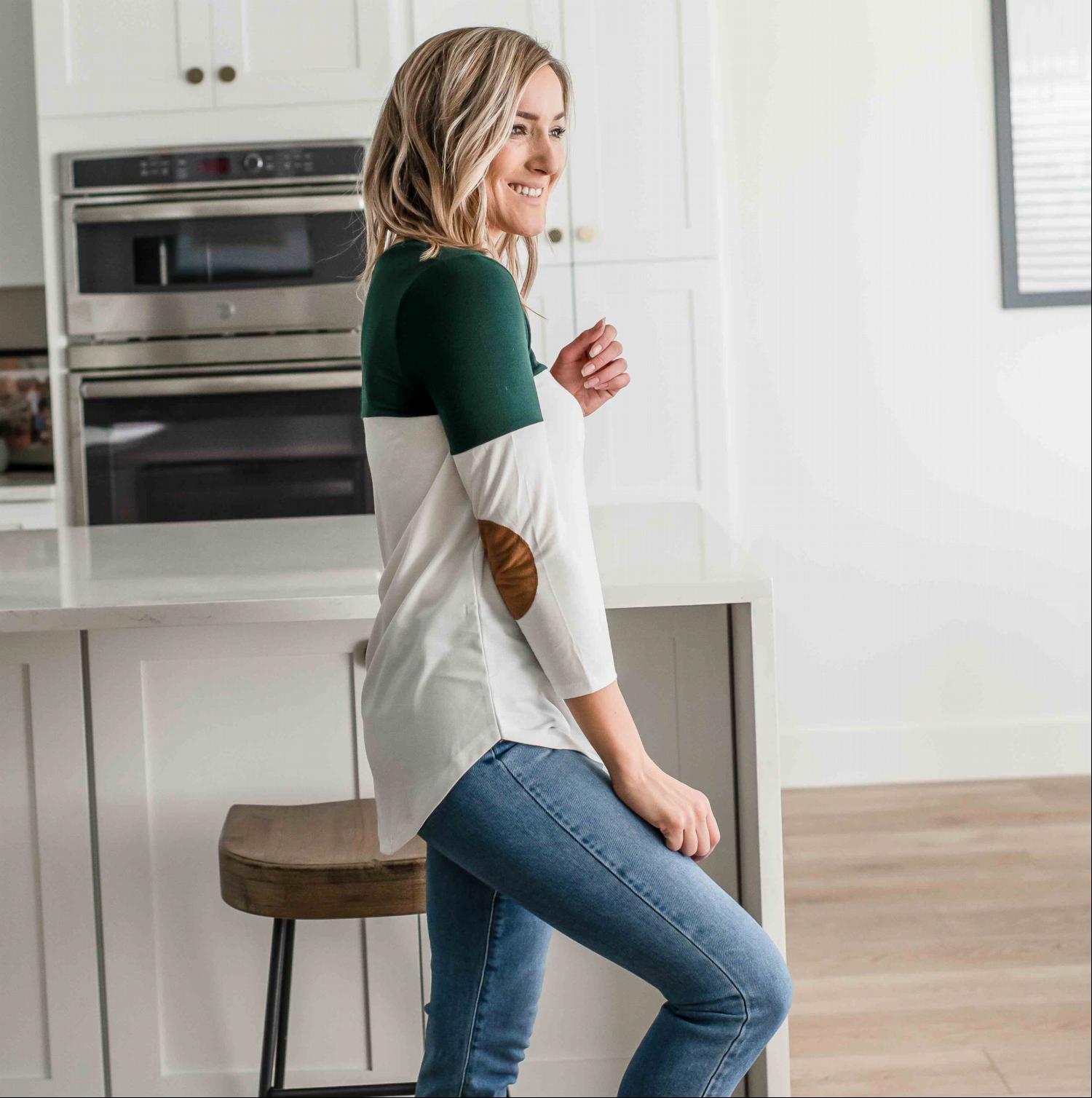 Chic Color Block Suede Pocket & Elbow Patch Top featuring a unique colorblock design with a brown suede pocket and elbow patches.