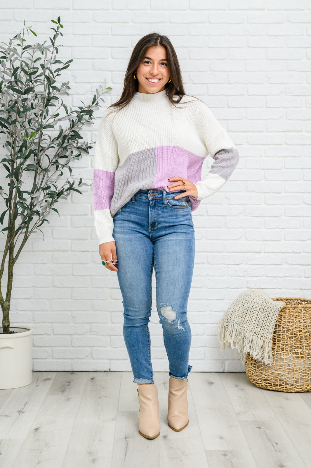 Lavender color block top featuring a mock neck design, showcasing three wintery shades in a cozy knit material.