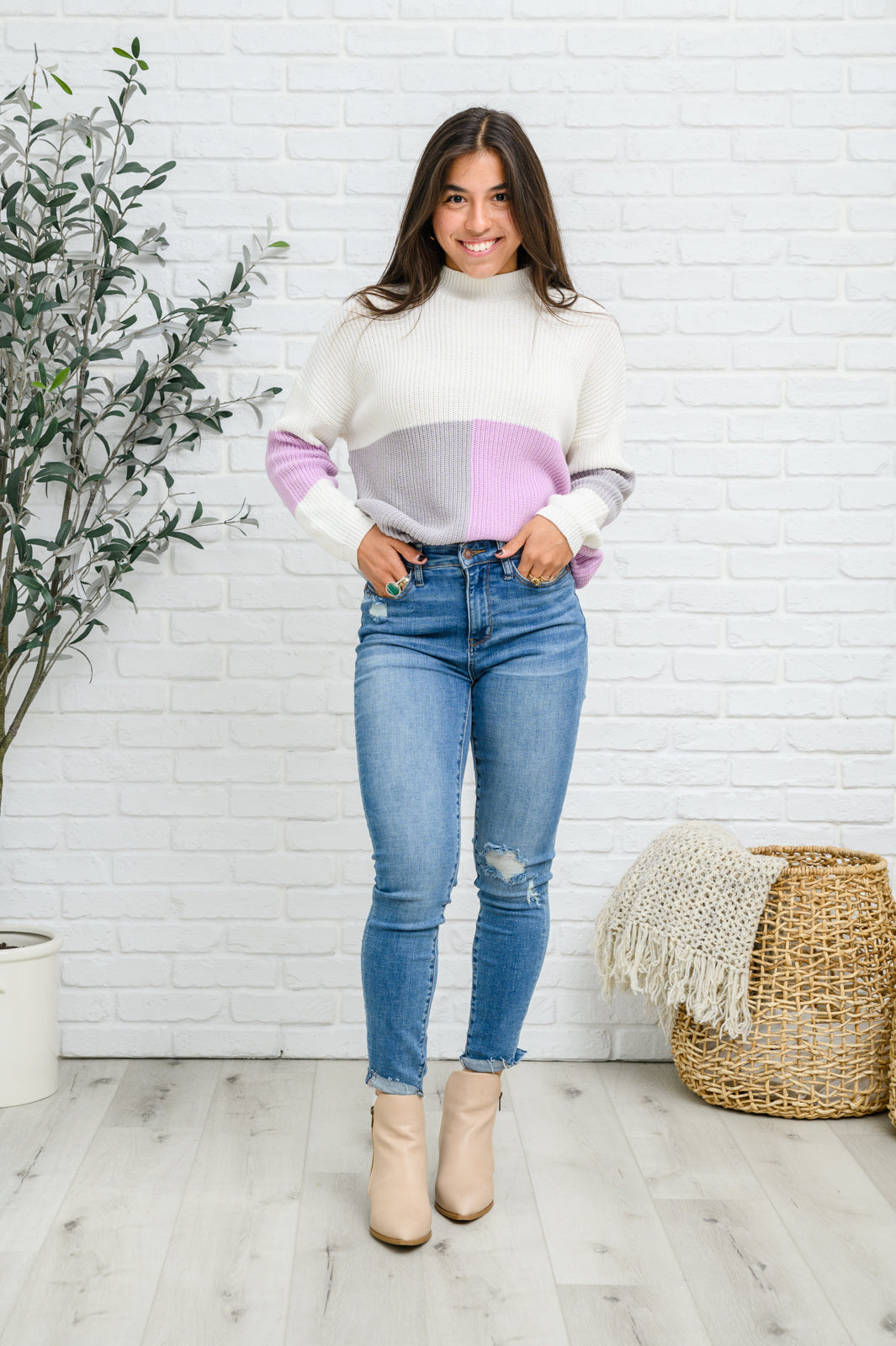 Lavender color block top featuring a mock neck design, showcasing three wintery shades in a cozy knit material.