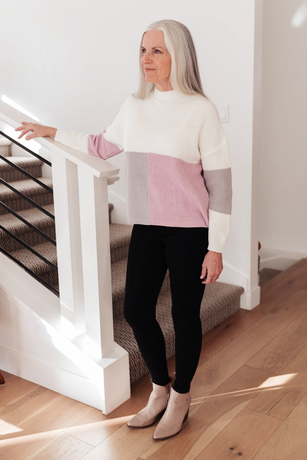 Lavender color block top featuring a mock neck design, showcasing three wintery shades in a cozy knit material.