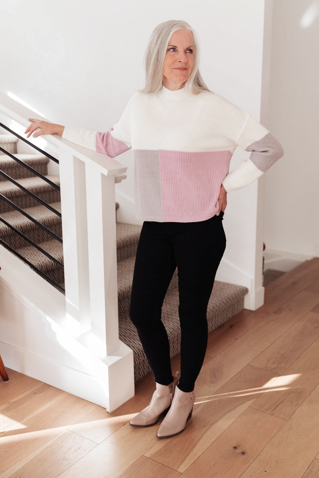 Lavender color block top featuring a mock neck design, showcasing three wintery shades in a cozy knit material.