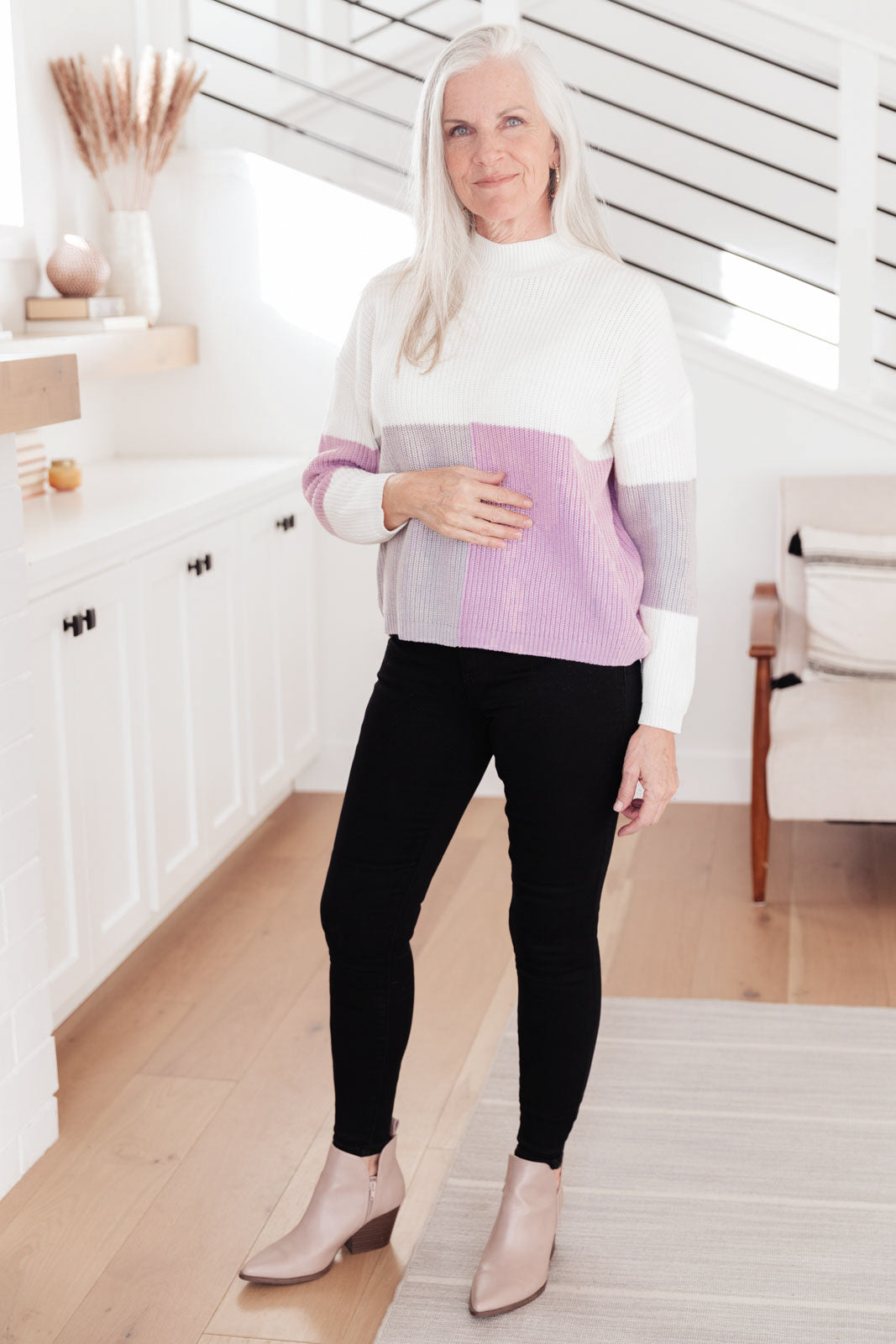 Lavender color block top featuring a mock neck design, showcasing three wintery shades in a cozy knit material.